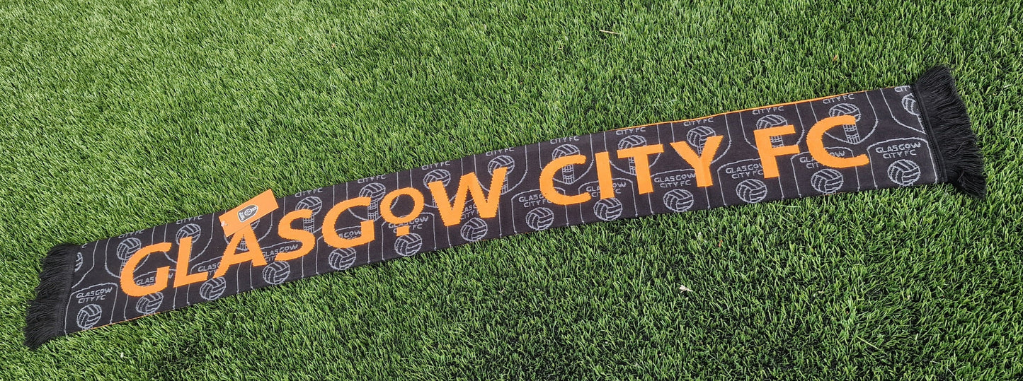 Glasgow City FC scarf on a grass background