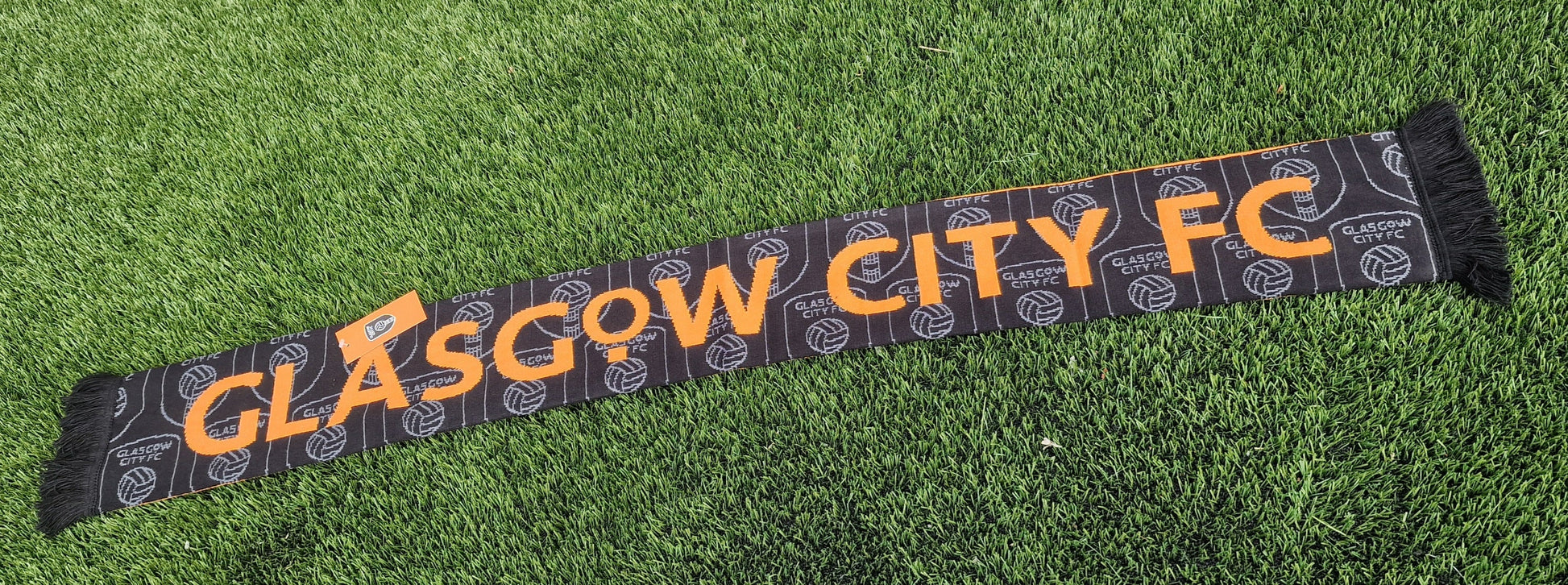 Glasgow City FC scarf on a grass background