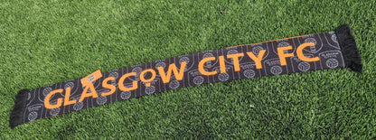 Glasgow City FC scarf on a grass background